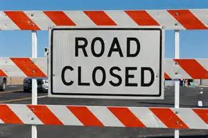 Road closed sign and barricades